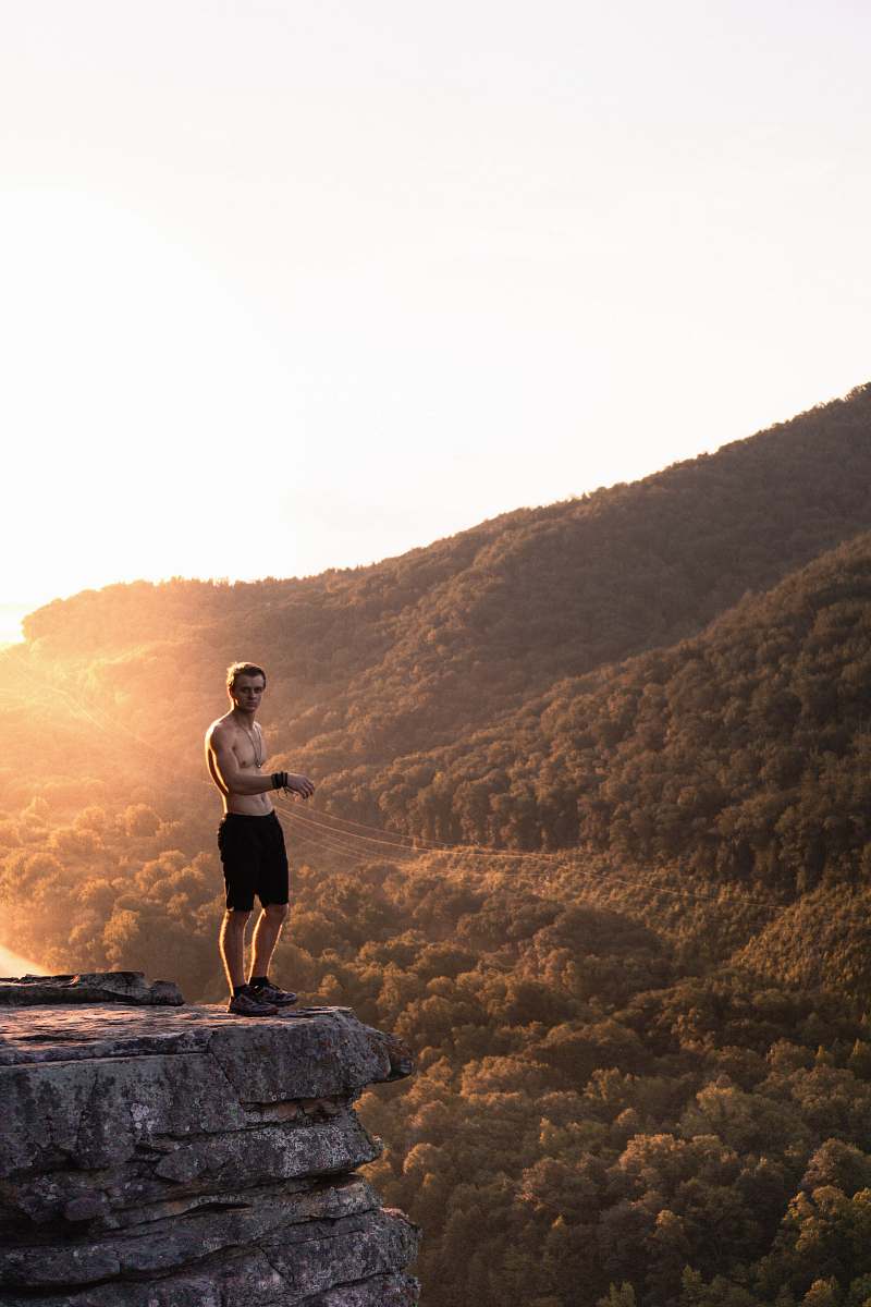 united states man standing on cliff exercise